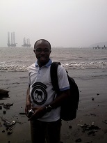 Outreach officer Mr. Innocent Yuh at the coast